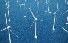 Aerial view of offshore wind turbine farm at sea. Also available: [url=stock-photo-21845469-wind-turbines-in-the-ocean.php][img]http://i.istockimg.com/file_thumbview_approve/21845469/2/stock-photo-21845469-wind-turbines-in-the-ocean.jpg[/img][/url]