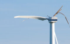 A broken wind turbine requires maintenance