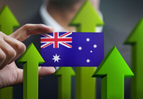 Nation Growth Concept, Green Up Arrows - Businessman Holding Card of Australia Flag