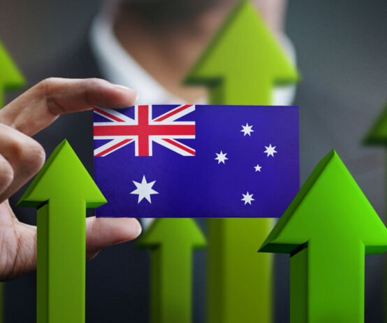 Nation Growth Concept, Green Up Arrows - Businessman Holding Card of Australia Flag