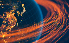 Global development capital illustrated by lines of light orbiting the globe
