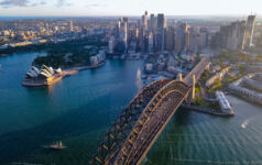 Aerial drone view of Sydney City and Sydney Harbour showing Sydney Harbour Bridge, NSW Australia in the late afternoon