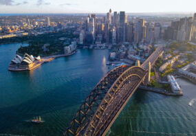 Aerial drone view of Sydney City and Sydney Harbour showing Sydney Harbour Bridge, NSW Australia in the late afternoon