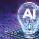 A light bulb on a microchip with the filament in the shape of the letters AI