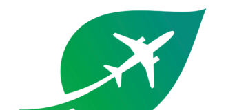 A white silhouette of a plane flying up over the green background shaped like a leaf