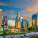 LACERA sees benefits as it leans into private infrastructure, co-investments Dusk light with dramatic clouds in downtown Los Angeles and freeway,California