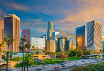 LACERA sees benefits as it leans into private infrastructure, co-investments Dusk light with dramatic clouds in downtown Los Angeles and freeway,California