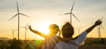 Wind turbines are alternative electricity sources, the concept of sustainable resources, People in the community with wind generators turbines, Renewable energy.