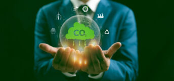 A Man hand showing globe with CO2 reducing icon with virtual and carbon credit to limit global warming from climate change concept. World for decrease carbon dioxide emission, carbon footprint.