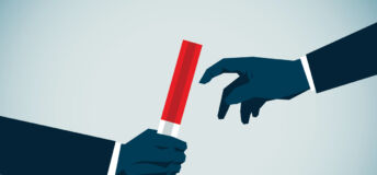 two hands pass a baton