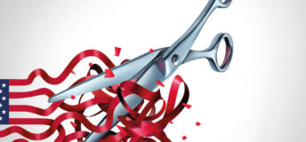 A metal pair of scissors cuts into red ribbons that form the stripes of the American flag