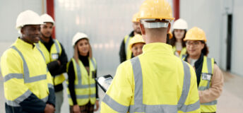 Construction, teamwork and people in meeting for planning, brainstorming and discussion in building. Architecture, engineering and men and women for inspection, property development and project