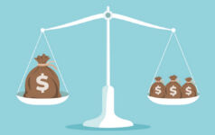 Image of a scale balancing money bags on both sides.