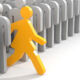 Yellow stick person steps out of a crowd of grey stick people