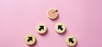 Arrow signs point to a target