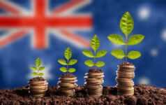 Economy Australia concept finance money is born in soil on plant with coins for successful investment, flag background
