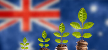 Economy Australia concept finance money is born in soil on plant with coins for successful investment, flag background