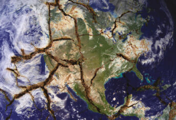 The earth viewed from space with fault lines cracking the surface