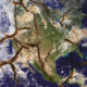 Political turmoil risks rupturing the energy transition map The earth viewed from space with fault lines cracking the surface