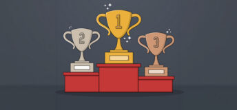 Three trophies with the numbers 1, 2 and 3 on them are placed on a podium