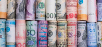 Closeup rolled of variety banknote and multi currency around the world. Exchange rate and Forex investment concept.-Image.