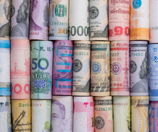 Closeup rolled of variety banknote and multi currency around the world. Exchange rate and Forex investment concept.-Image.