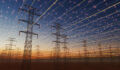 Clifford Capital Asset Management plans opportunistic infra credit fund โ exclusive A futuristic visualization of high-voltage transmission towers beneath a digital energy grid. Glowing network lines and light points span across the sky, symbolizing smart grid technology, connectivity, and the modernization of electrical infrastructure at sunset.