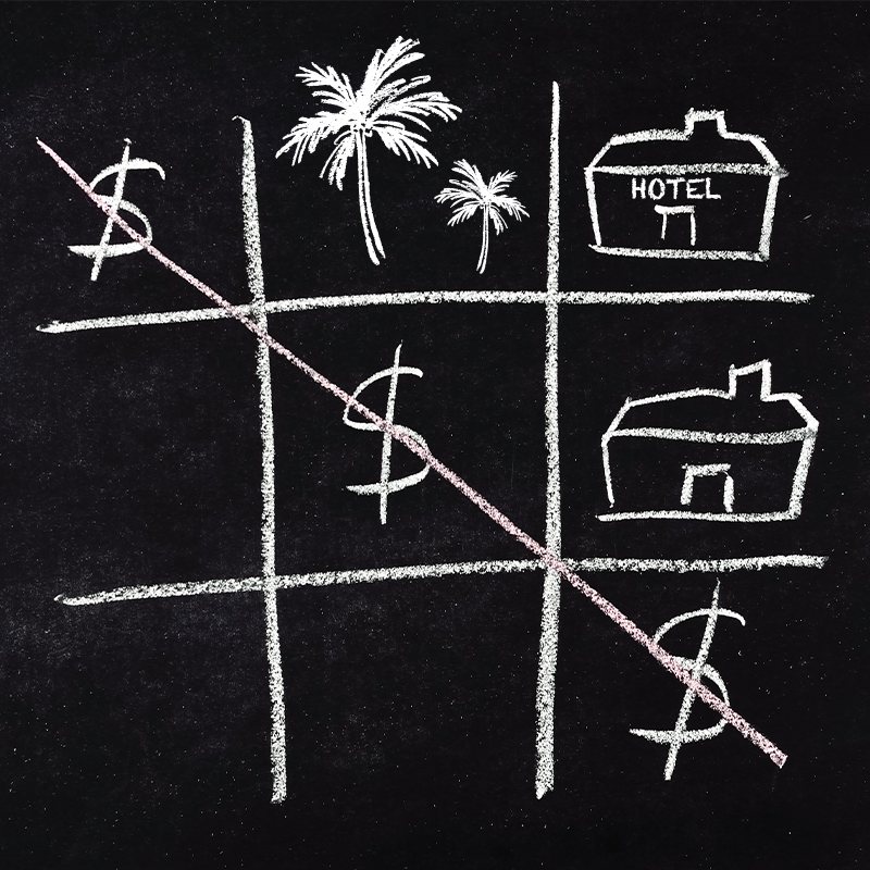 A game of noughts and crosses on a blackboard, but with US dollar signs completing a diagonal, with drawings of palm trees and hotels in the other spaces