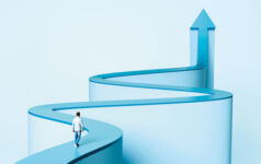 A person walking along a winding path that morphs into an arrow that points up