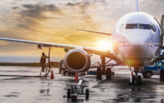 Fierce competition prompts transport investors to look beyond core assets An aeroplane at an airport being refuelled and loaded as the sun sets or rises over the horizon