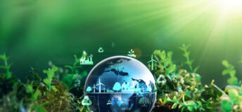 Green energy for clean and sustainable environment. Wind energy used in the industry of factories, machines and technologies. Reducing Co2 emissions and limiting global warming and climate change.